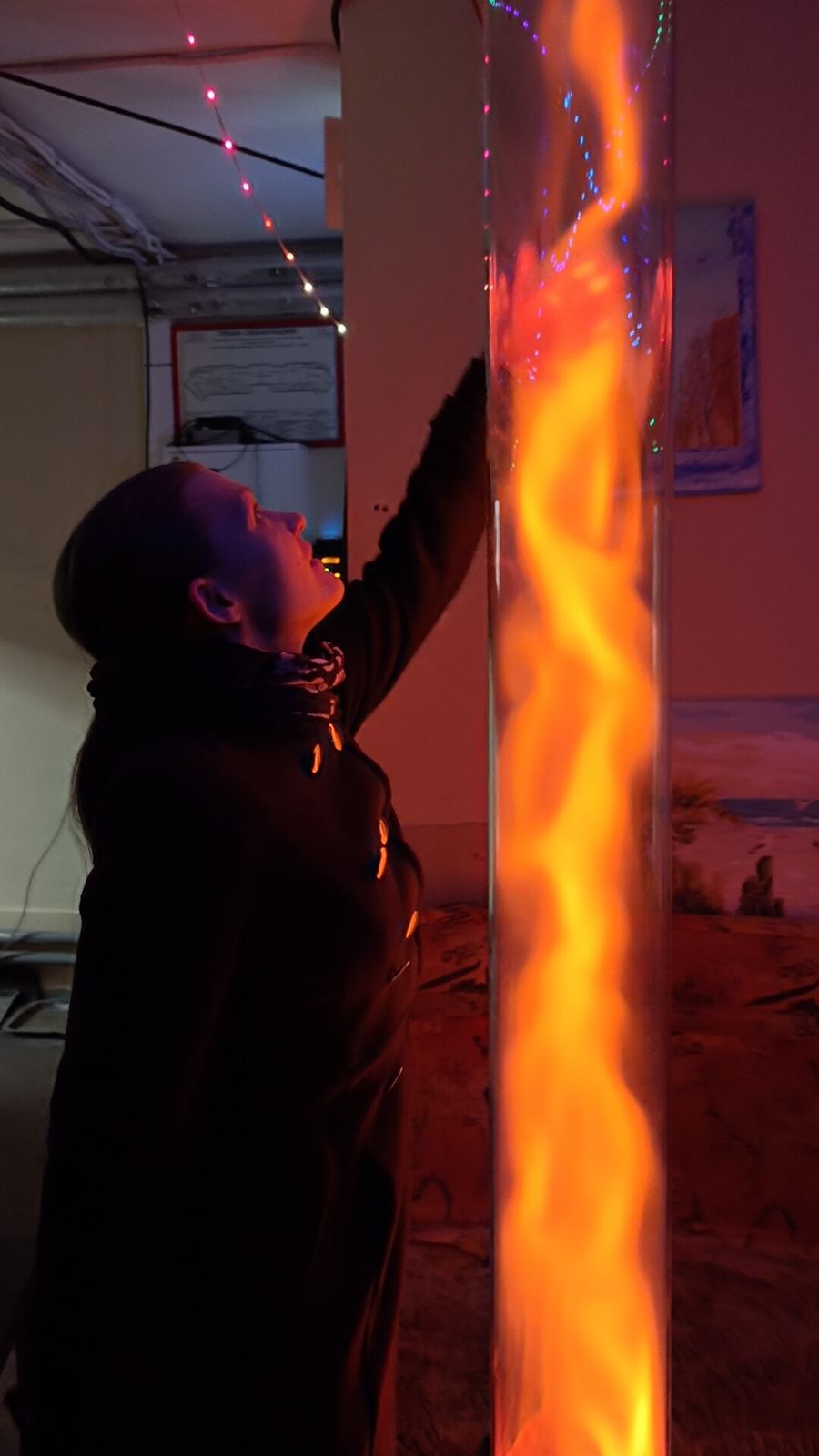 Touching an orange plasma tube
